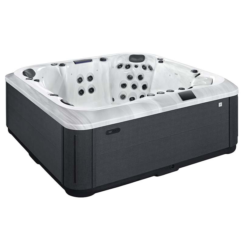 Whirlpool mit vielen Düsen und grauem Außenbereich
